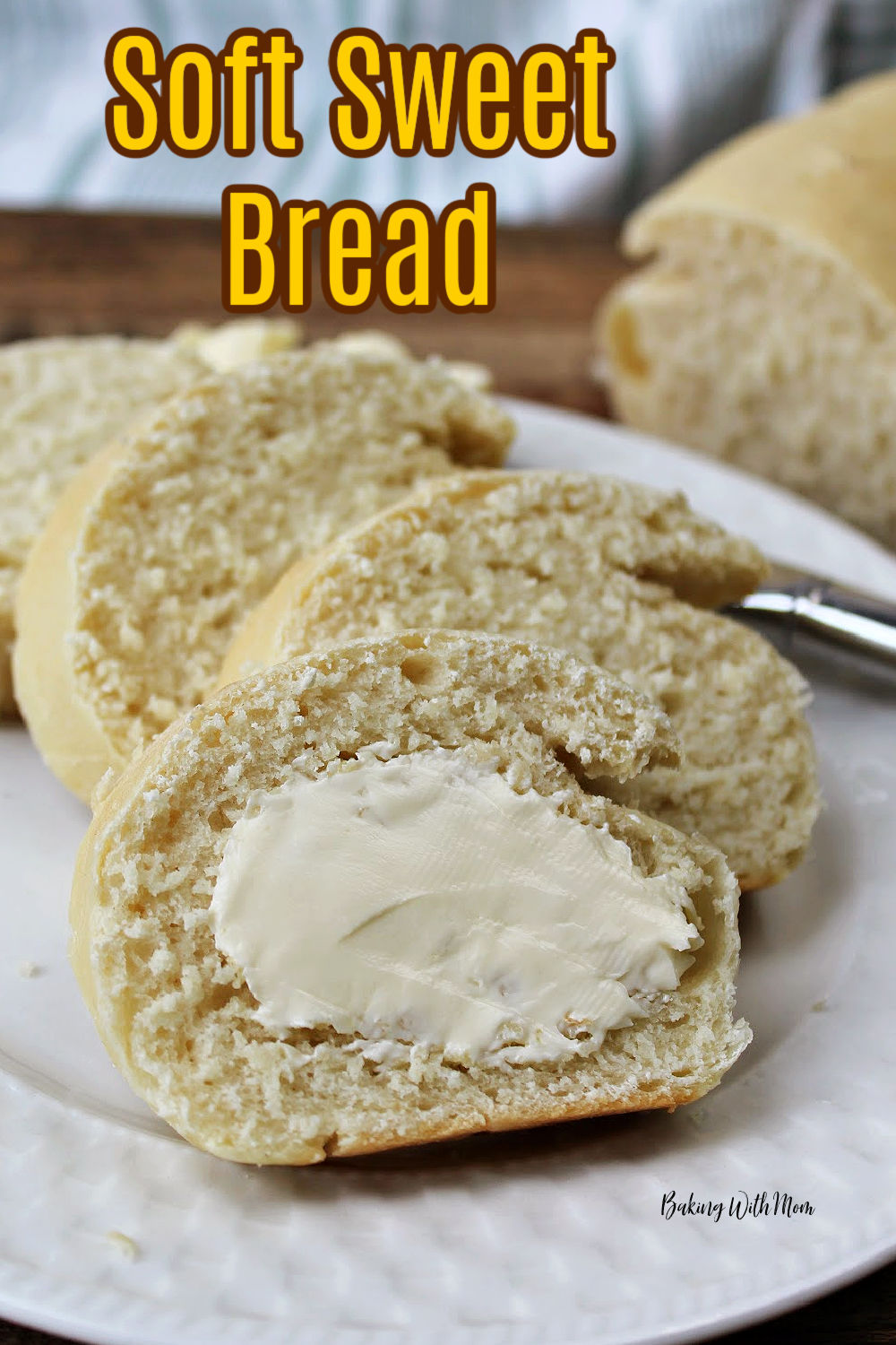 Soft Sweet Bread in slices on a white plate with a knife behind. 