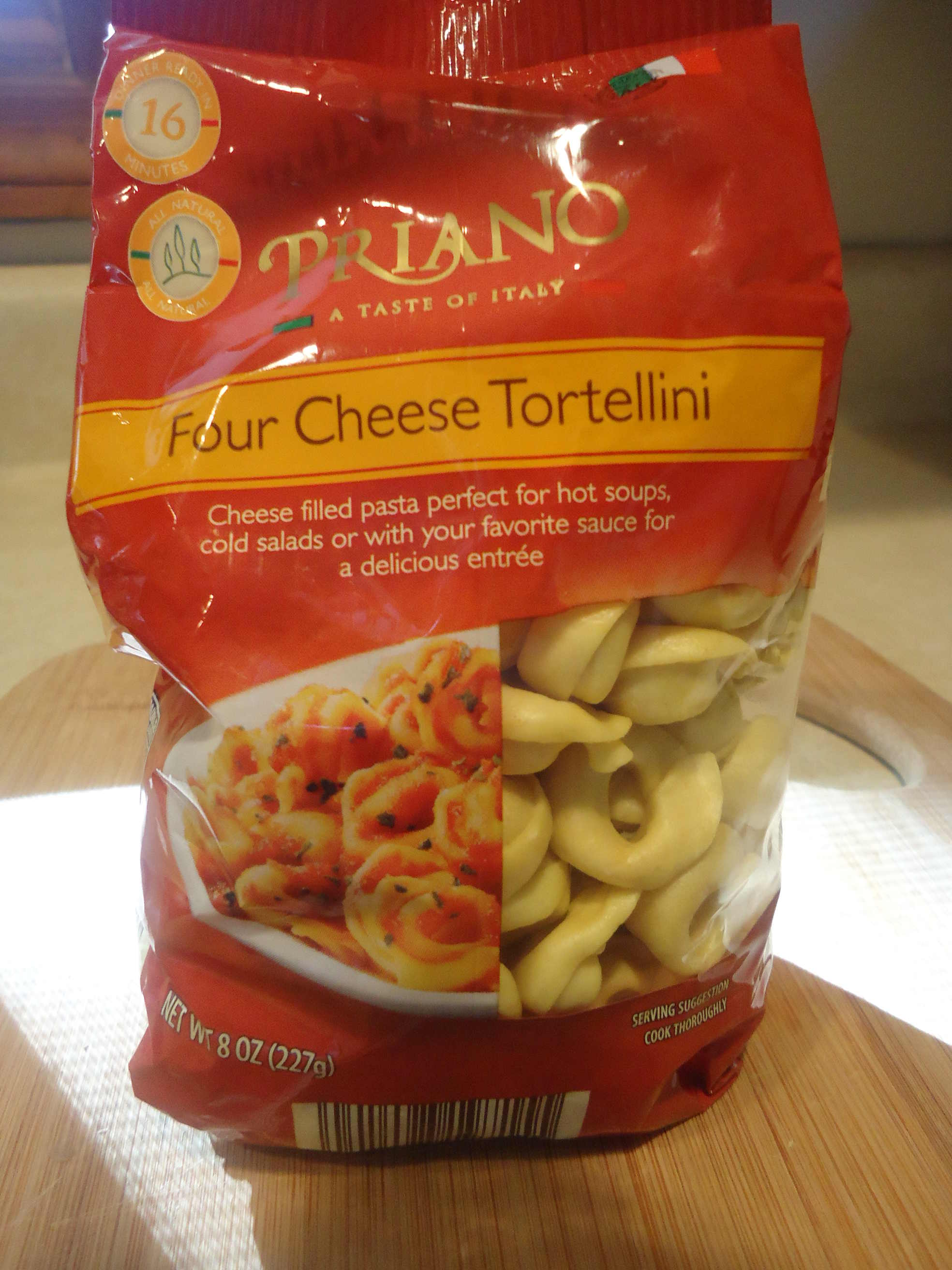 4 cheese tortellini in a red bag.