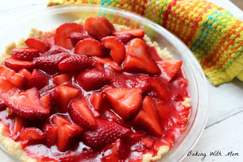 Easy Strawberry Pie in a pie pan sitting next to a colored towel
