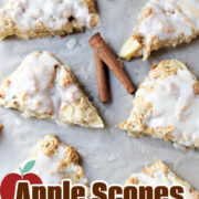 Six apple scones on a baking sheet.
