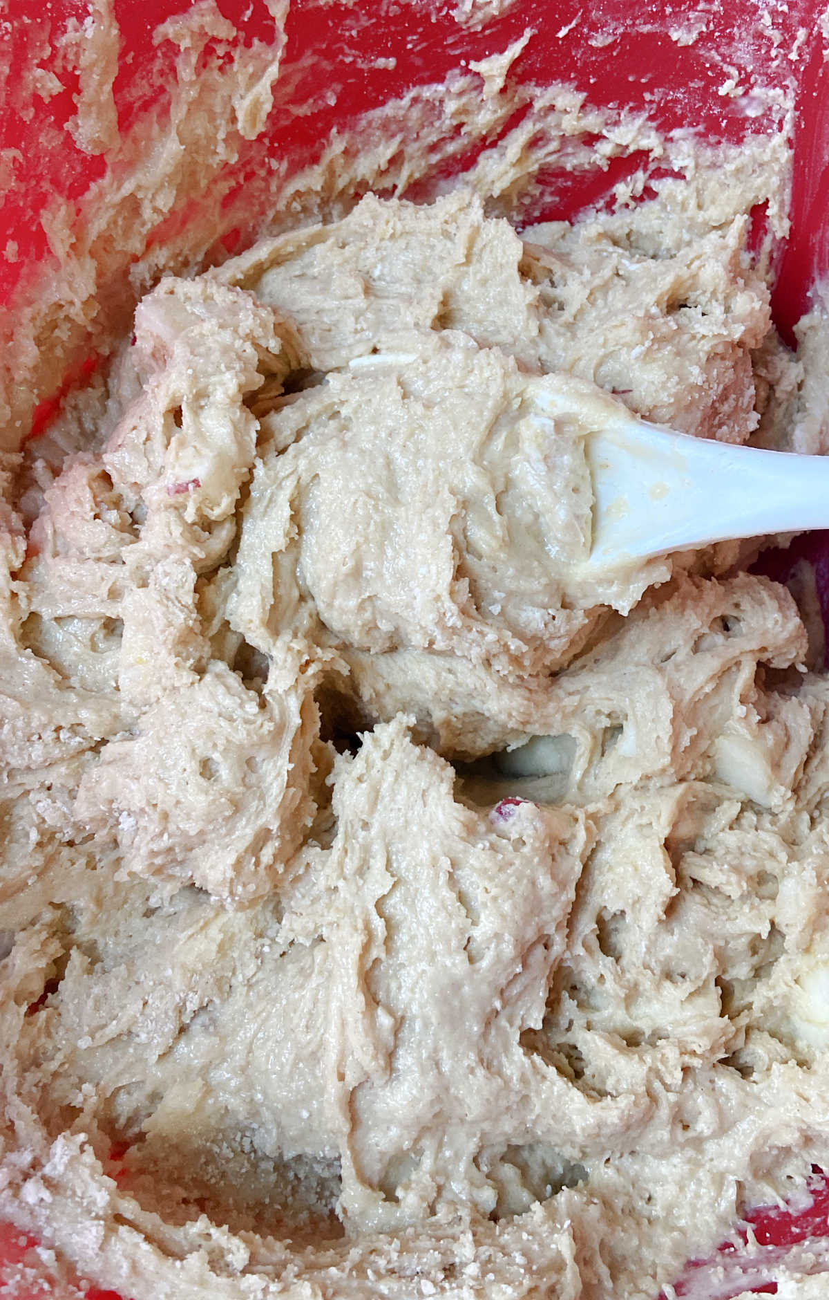 coffee cake batter in a red bowl.