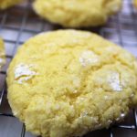 Gooey Butter Cookies on a cooling rack with powdered sugar
