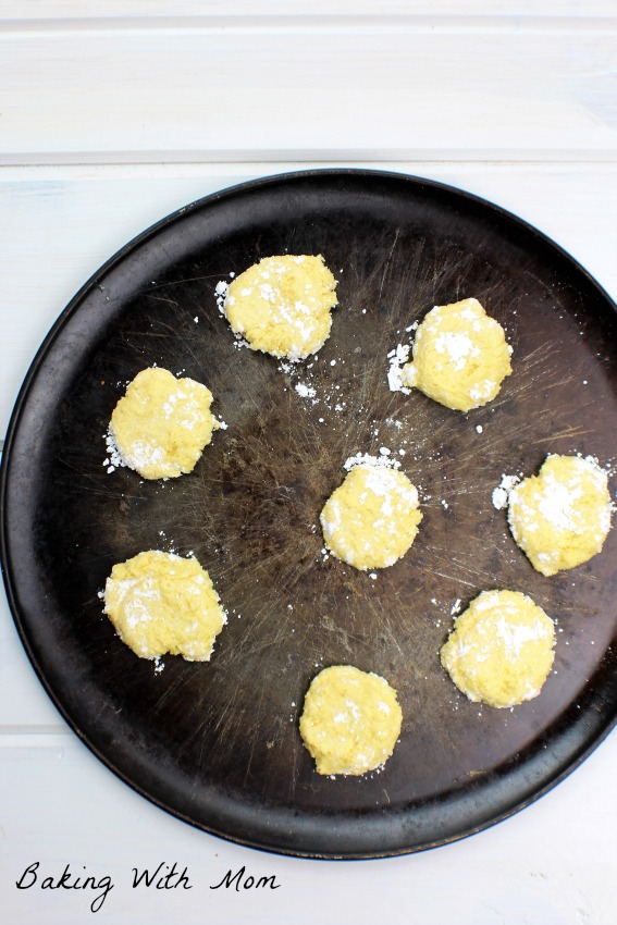 Rolled gooey butter cookies on a cookie sheet