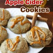 apple cider cookies on a white plate with caramel.