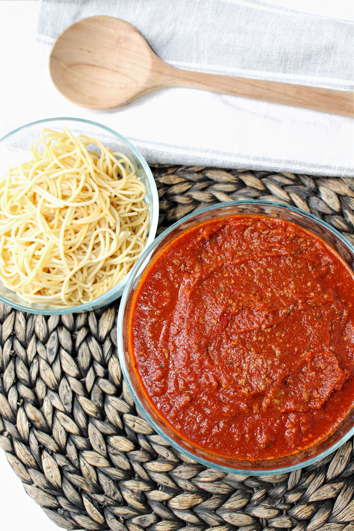 sauce in a bowl with a wooden spoon.