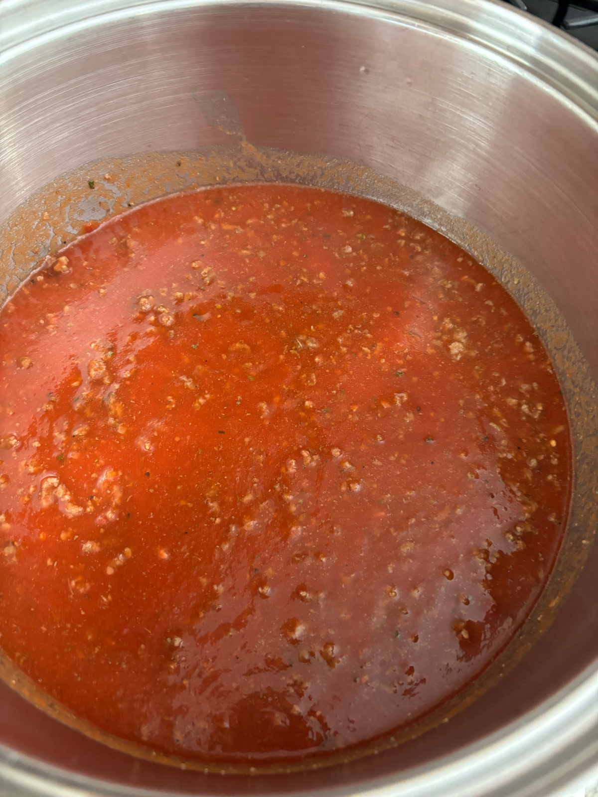spaghetti sauce in a stainless pot.