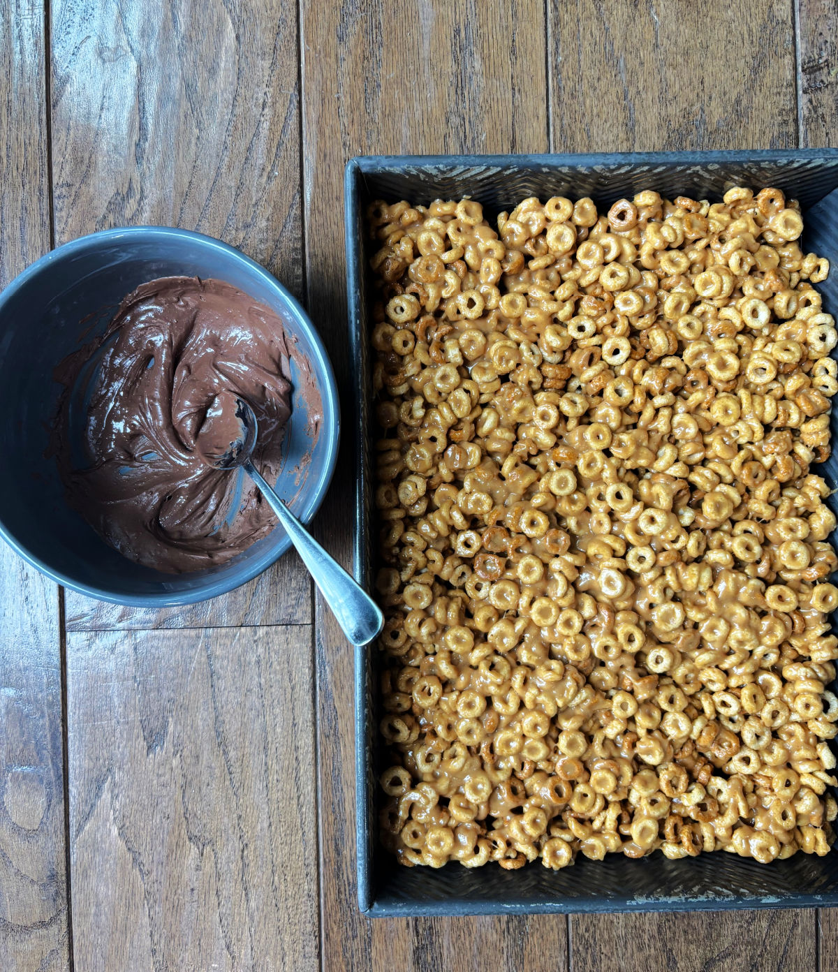 cheerios in a pan and chocolate in a bowl. 