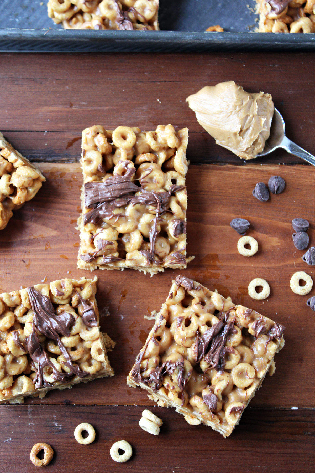 gooey peanut butter bars on a brown tray.