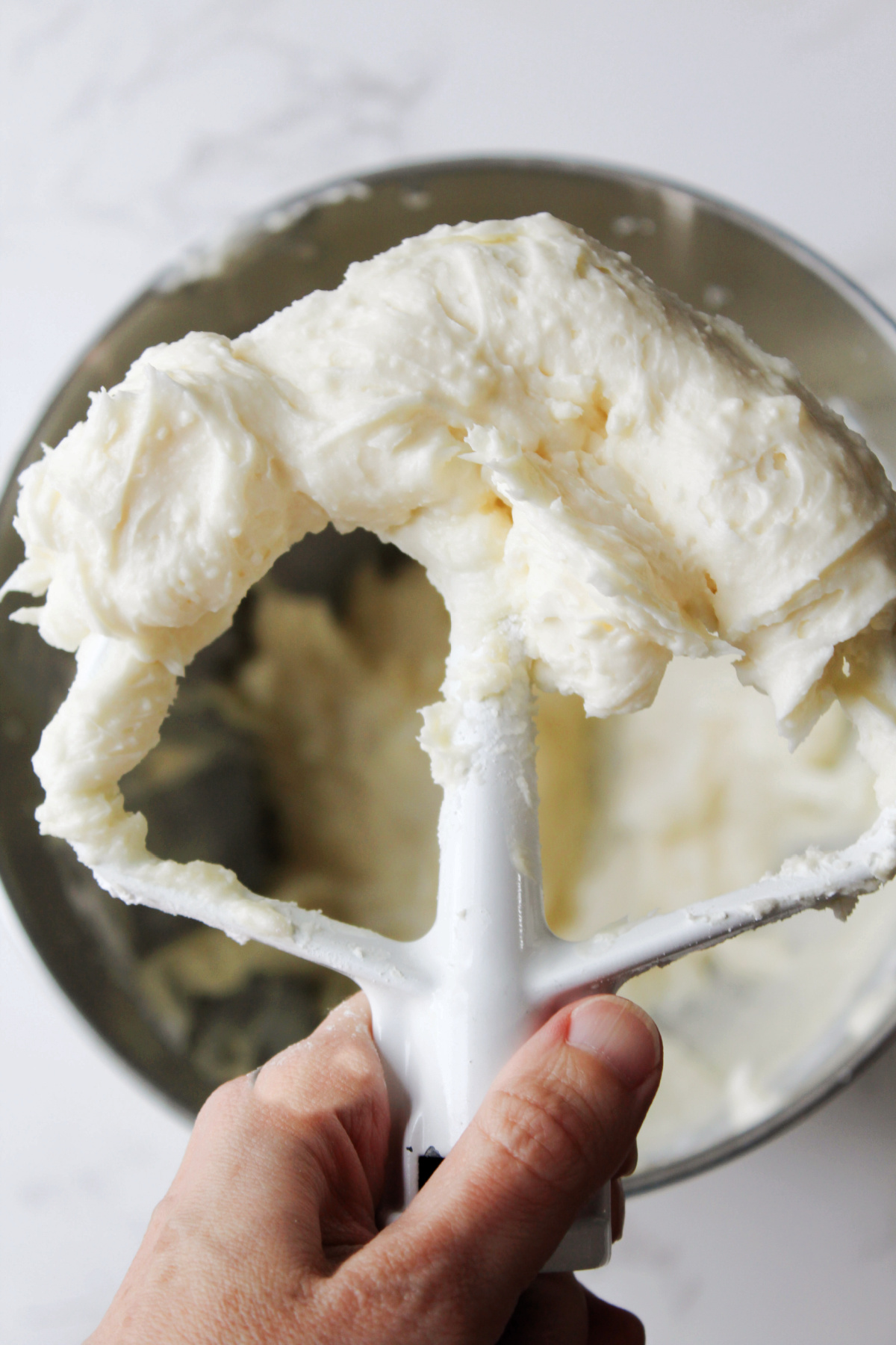 cream cheese frosting on a paddle.