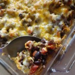 taco tortilla casserole with beans, tomatoes and spices