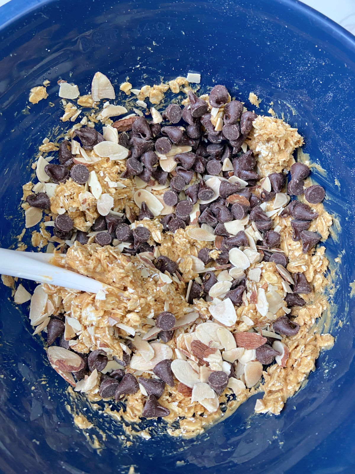 chocolate chips and oats in a blue bowl. 