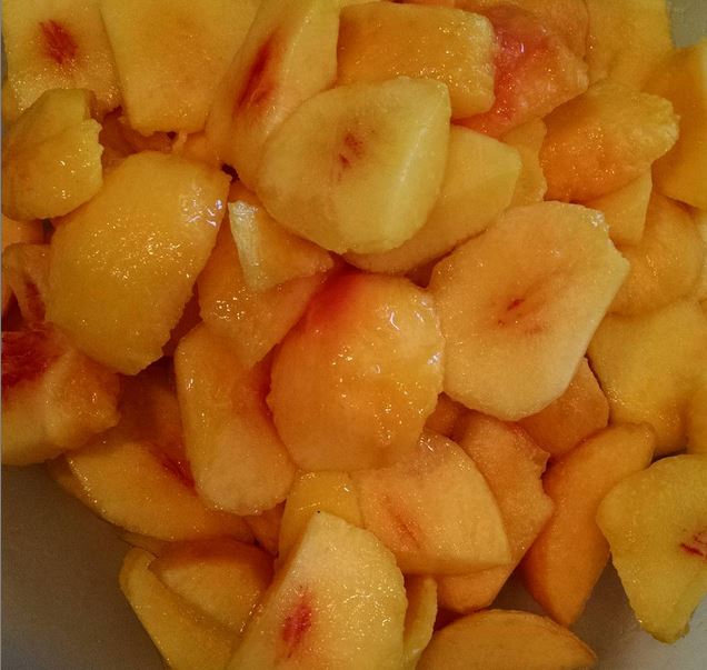 Fresh peaches cut and skins removed