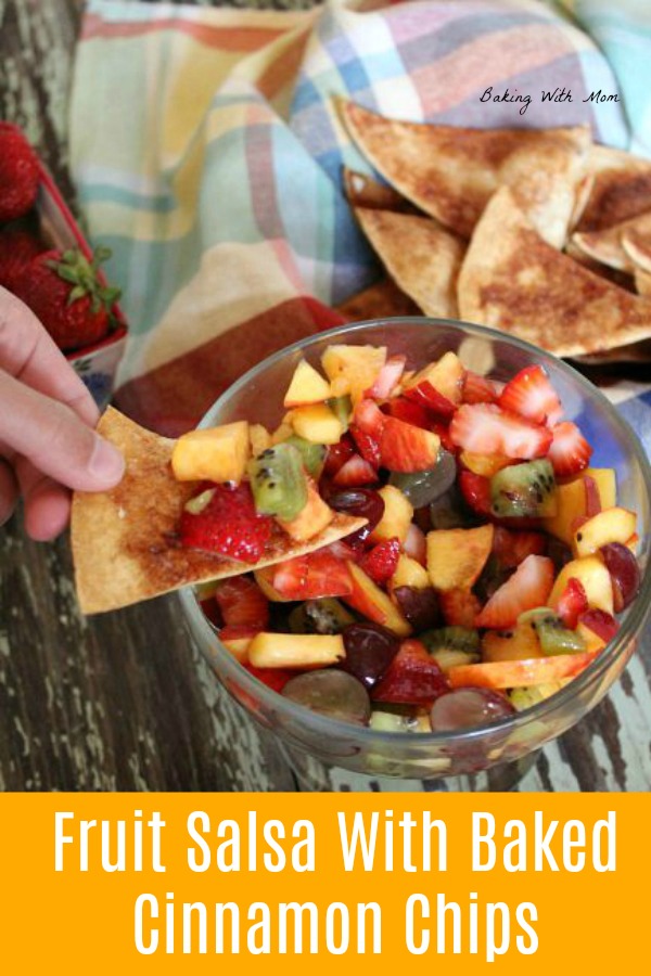 Fruit salsa with strawberries, kiwi and a variety of fruit in a clear bowl