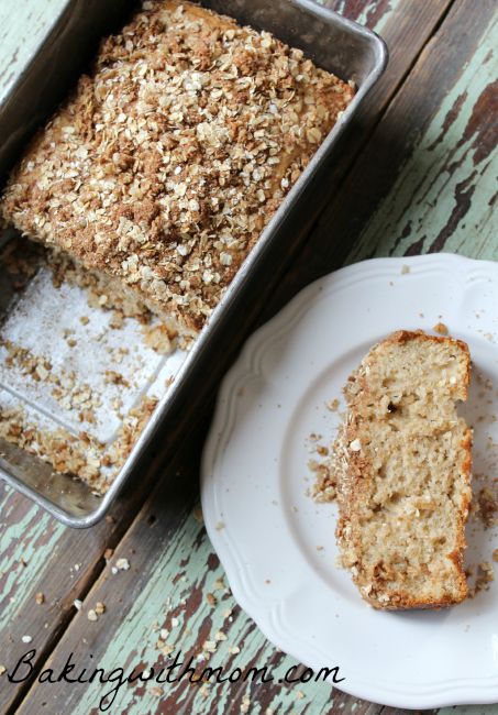 apple cinnamon bread  on a white plate next to a loaf pan