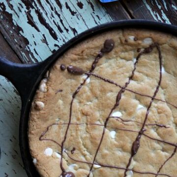 White Chocolate Chip Skillet Cookie in white chocolate chip in a cast iron skillet