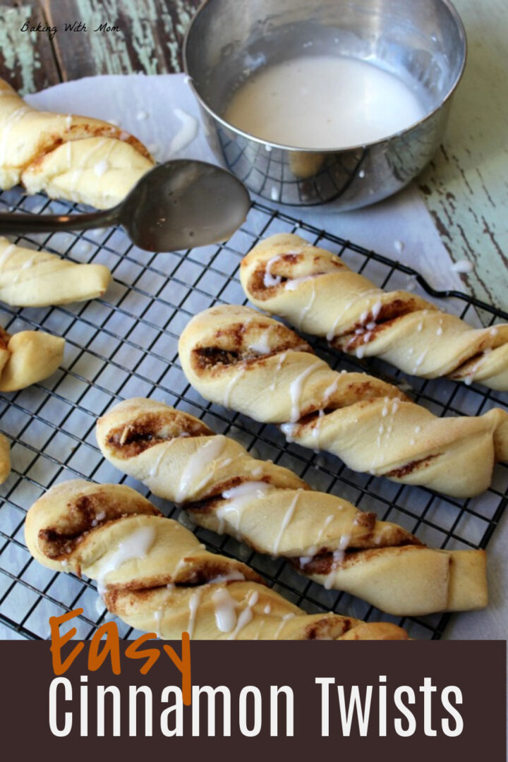 Cinnamon twists on a cooling rack with a bowl of frosting above.