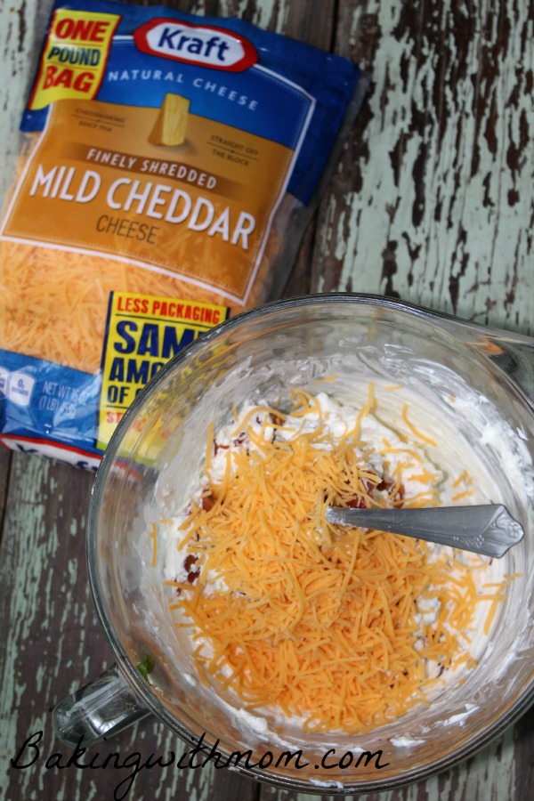 Cream cheese and bacon and cheddar cheese in a mixing bowl