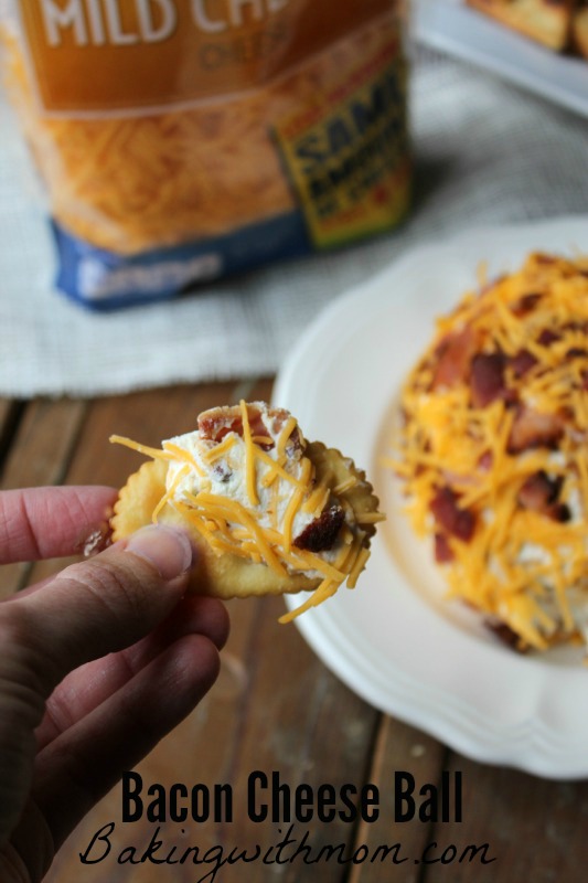 Bacon Cheese Ball recipe with cheese, bacon and onion on a cracker