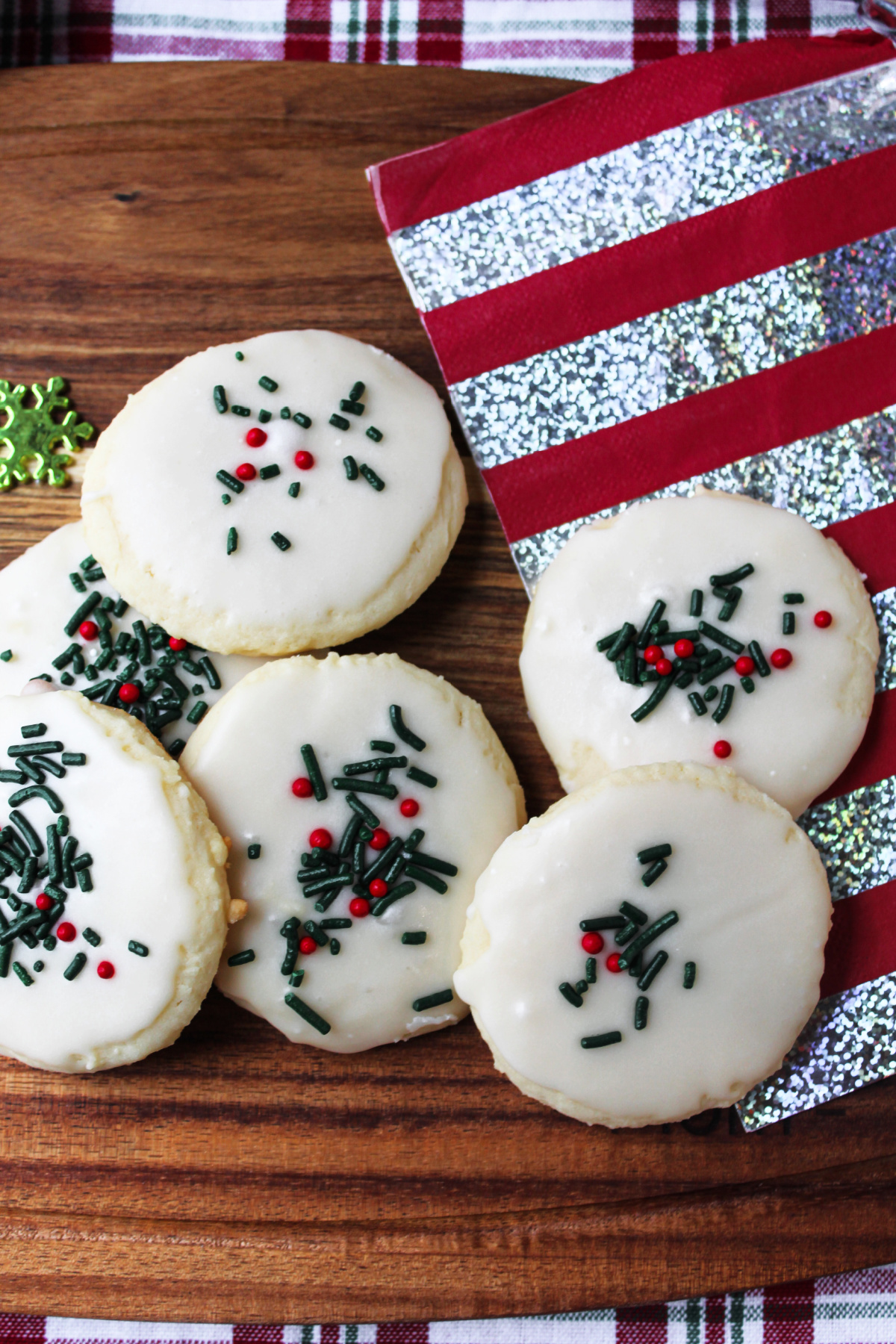 white velvet cookies on a board with a napkin nearby.