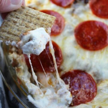 Close up of pizza dip with cracker