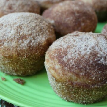 plate holding cinnamon sugar coated muffins