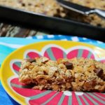 granola bar with chocolate chips on a colorful plate