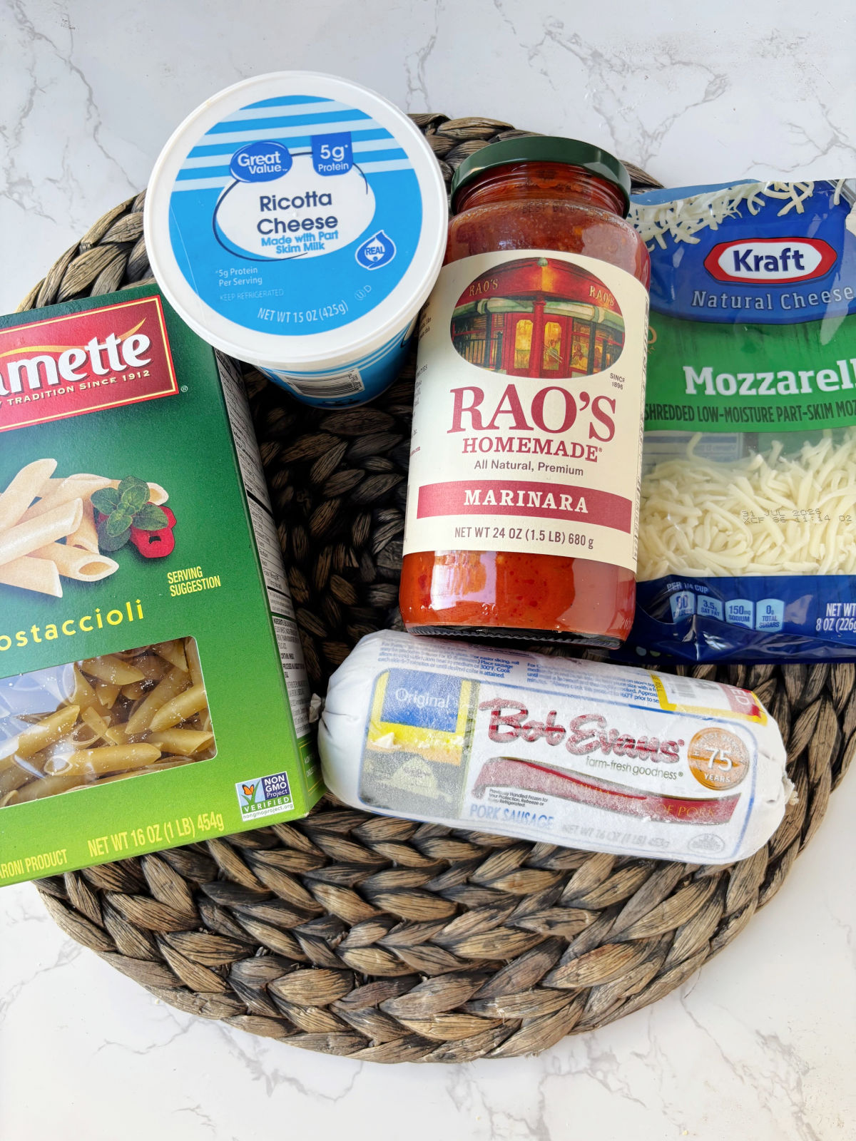 mostaccioli ingredients - pasta sauce, sausage, ricotta cheese.