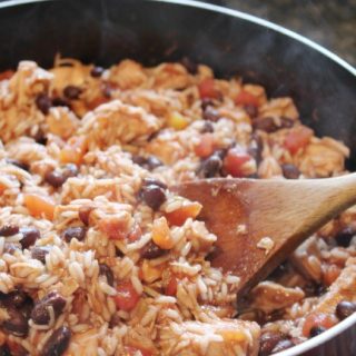 rice, beans, chicken in a frying pan