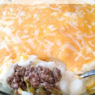 Simple Shepherd's Pie Hamburger, green beans and mashed potatoes in a round dish