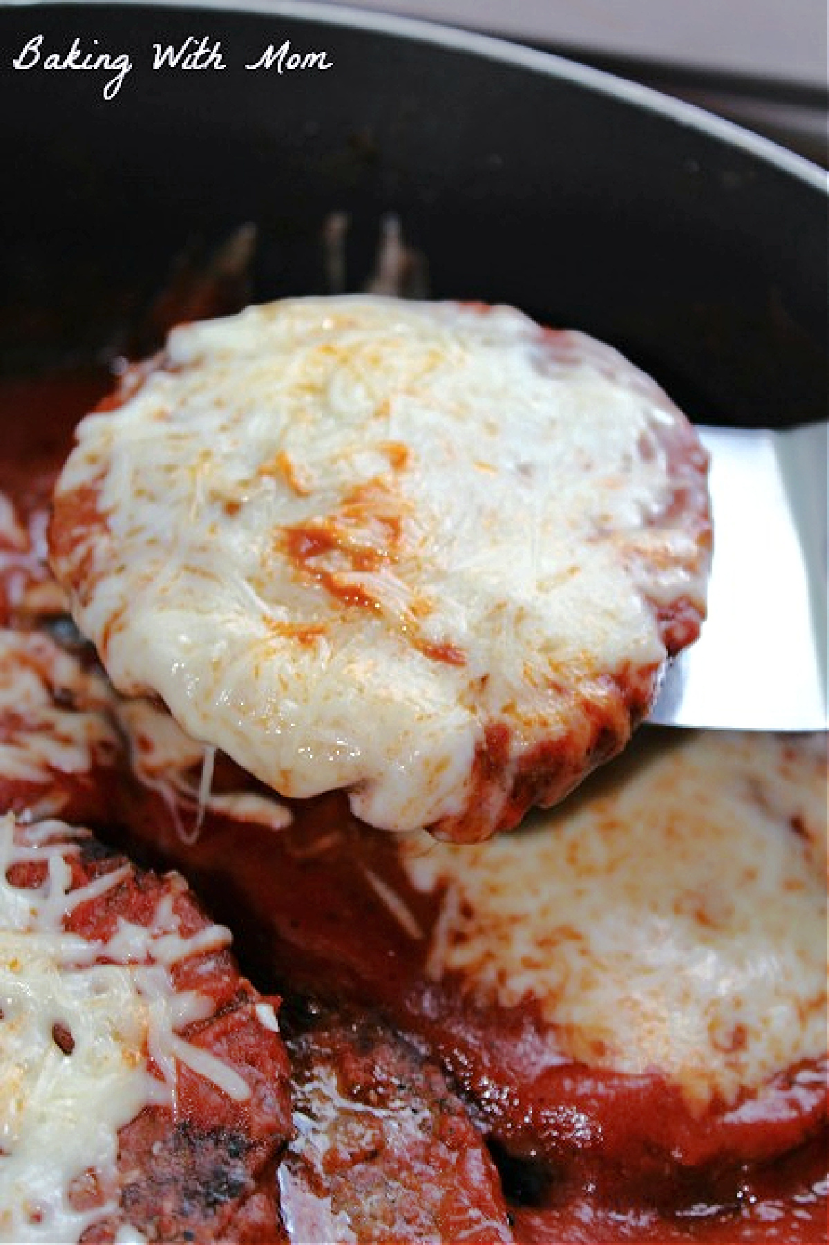 pizza burger with cheese on top.