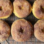 pumpkin donuts on a cooling rack