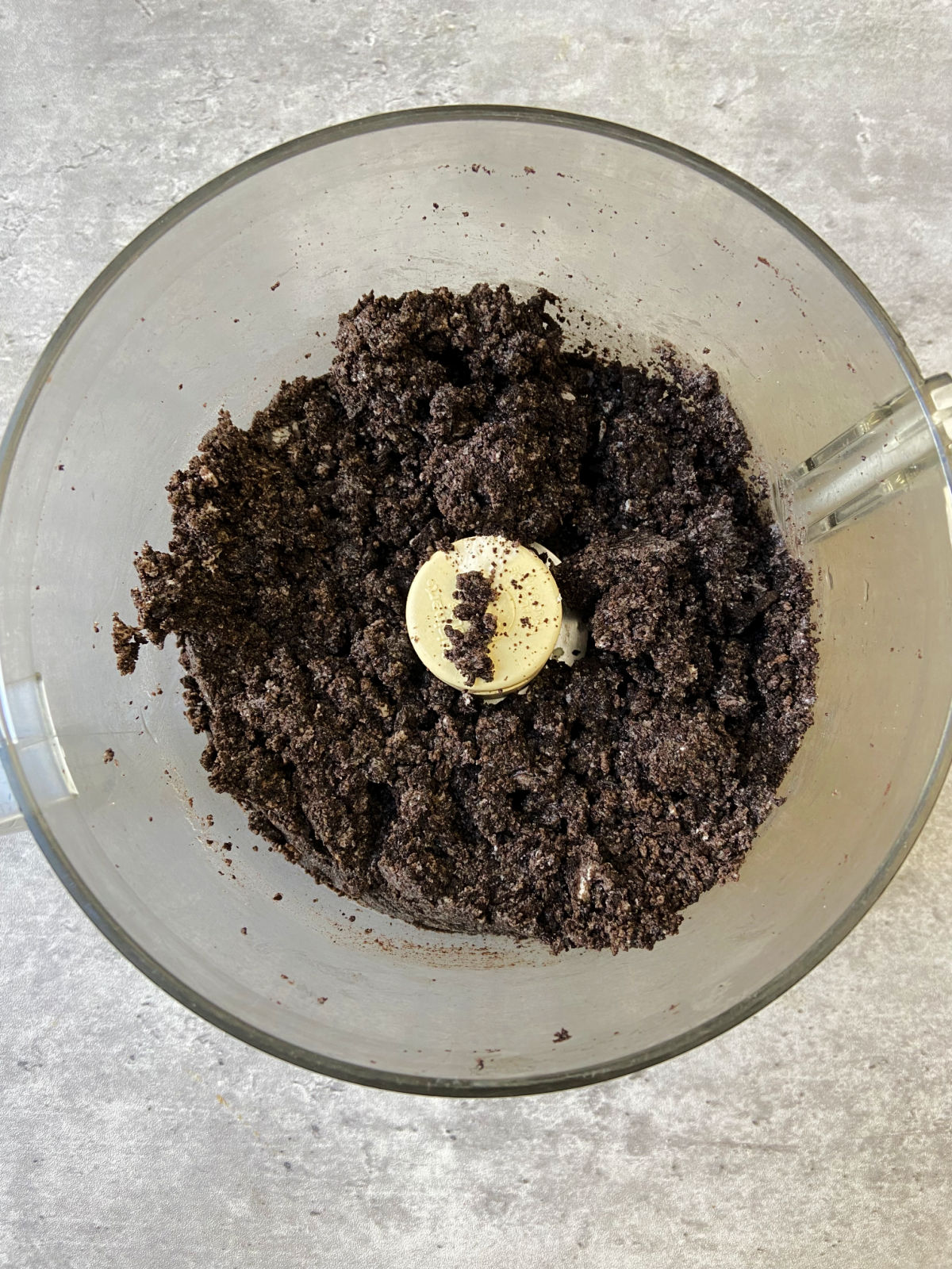 Oreo crumbs in a food processor.