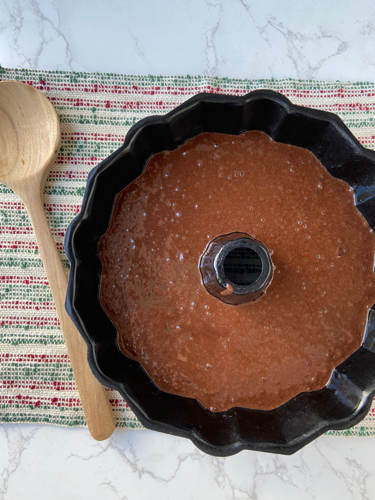 chocolate cake batter in a Bundt pan. 