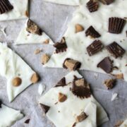 peanut butter cups and chips in candy bark on waxed paper