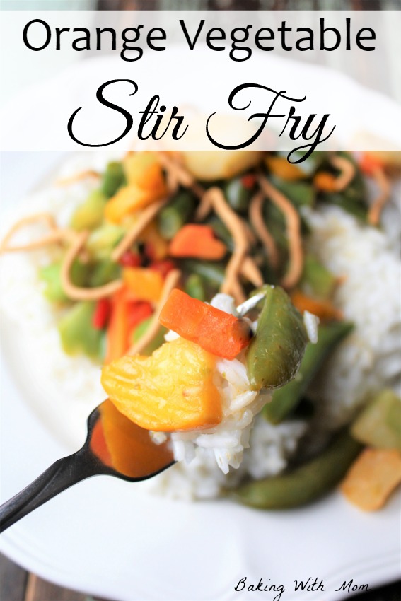 Orange Vegetable Stir Fry with a healthy vegetables and crunchy chow mein noodles on a white plate