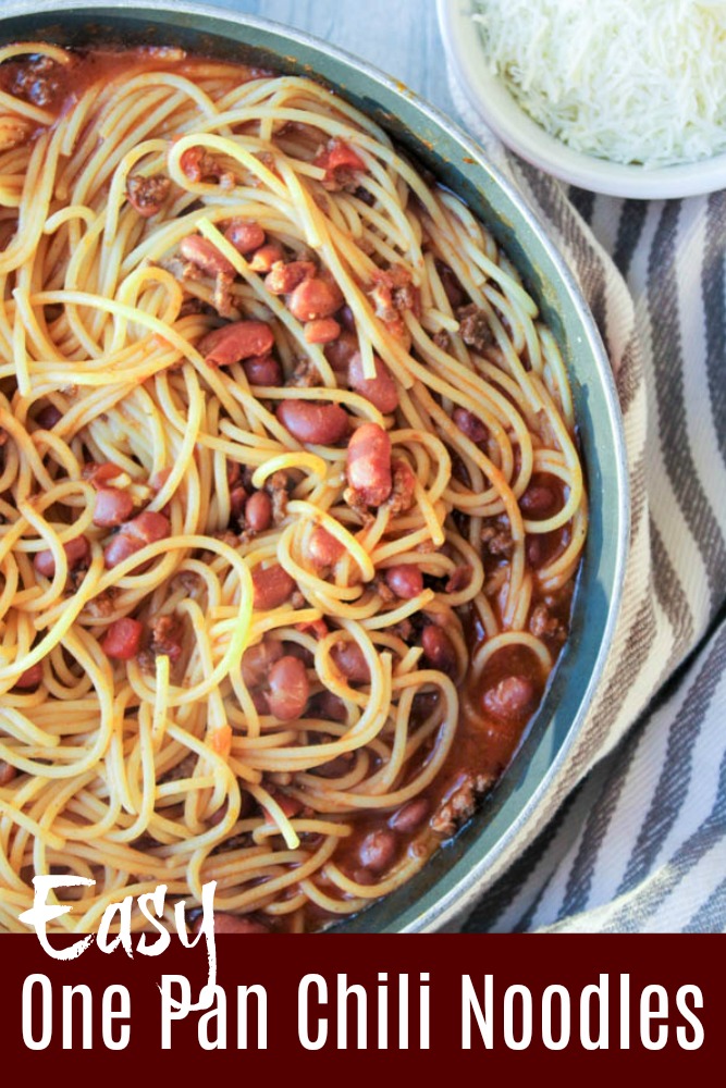 Chili noodles with a striped towel and shredded cheese