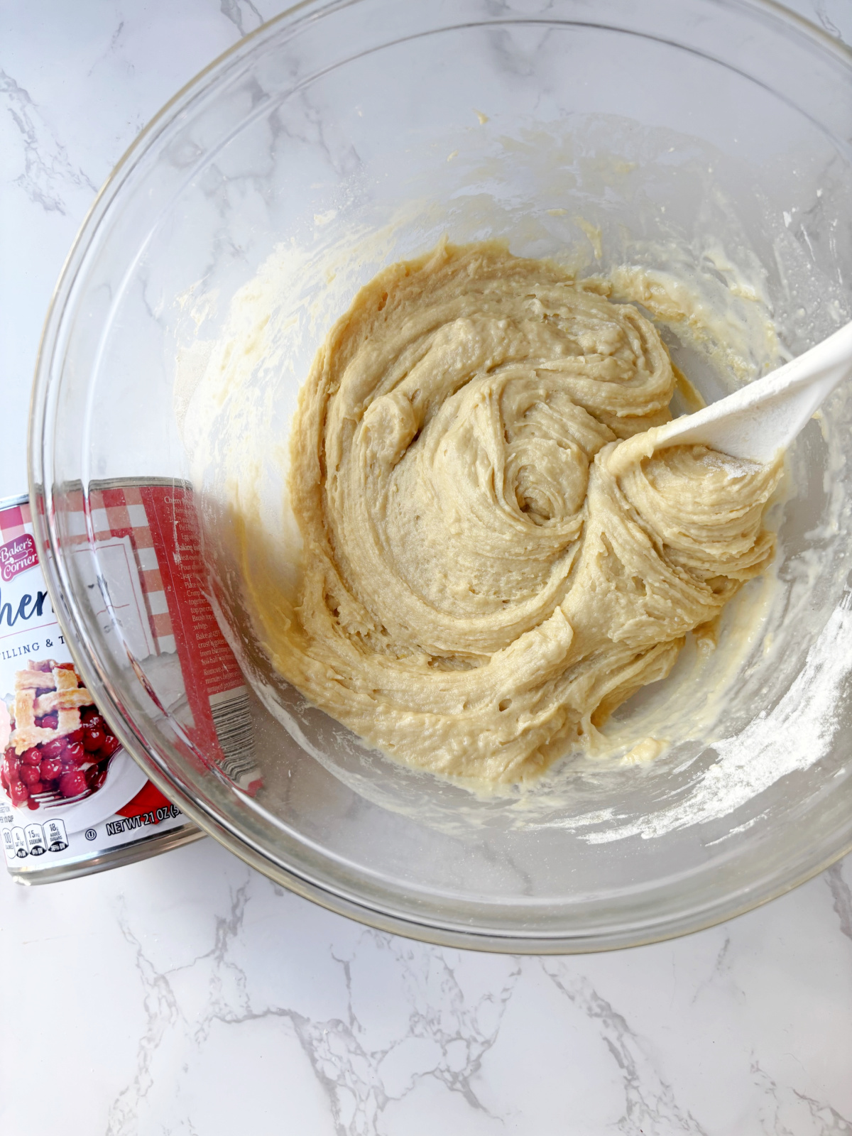 batter with cherries beside.