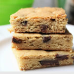 Stack of 3 cookie bars on a plate.