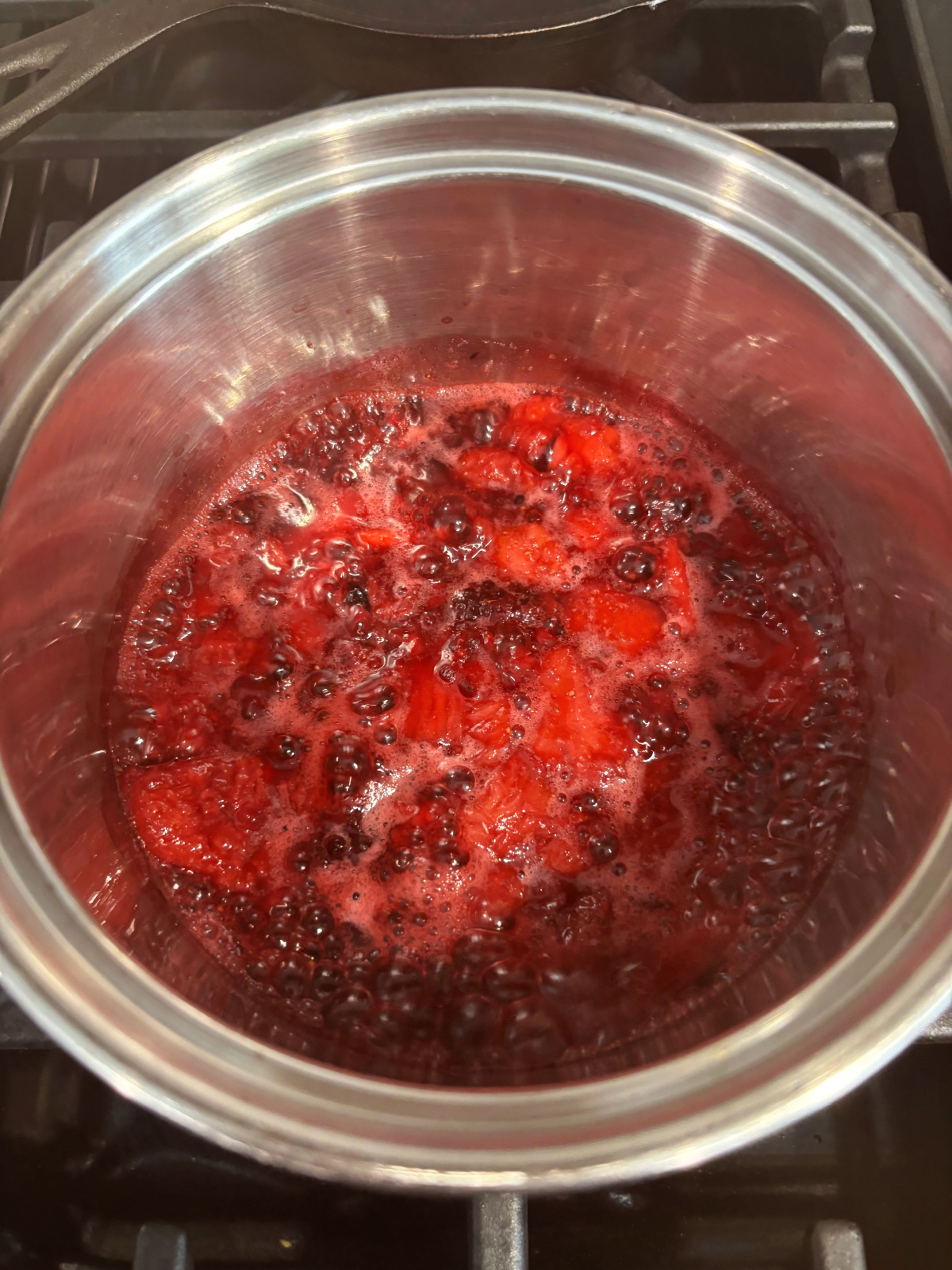 crushed berry sauce in a pan. 