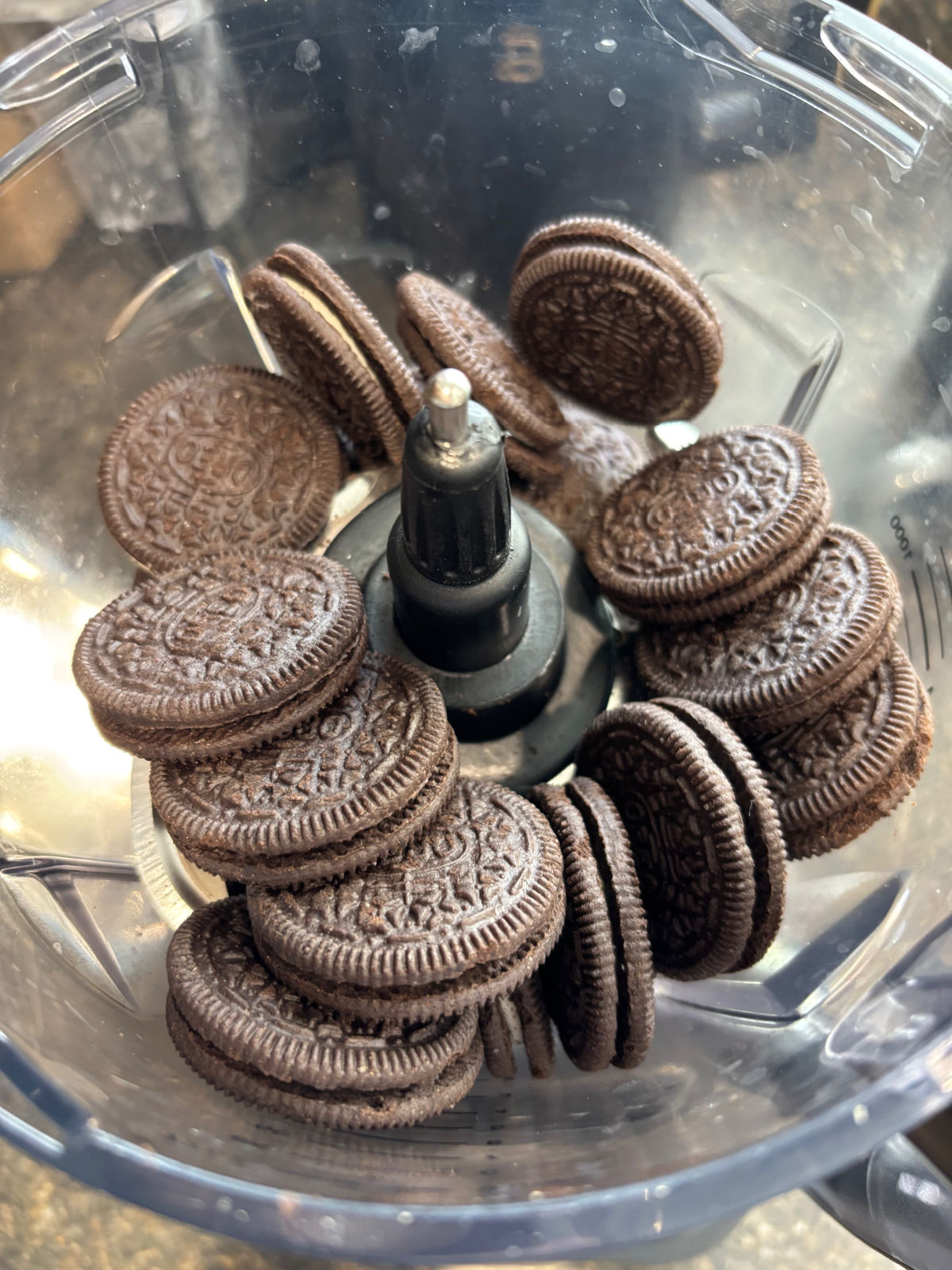 Oreos in a food processor on the counter. 