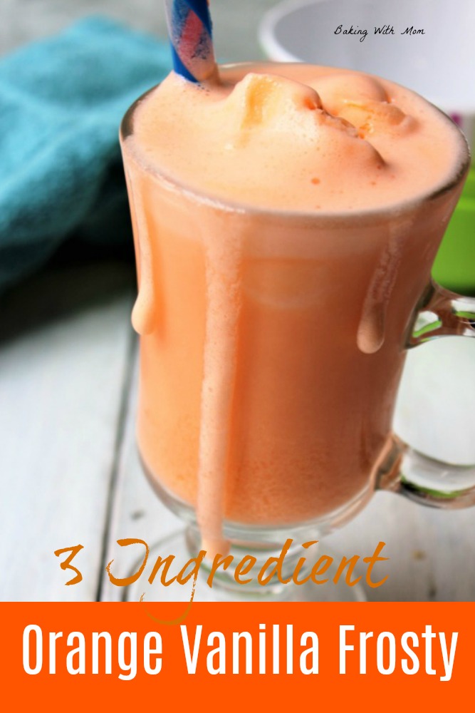 Orange vanilla frosty in a clear mug with a straw