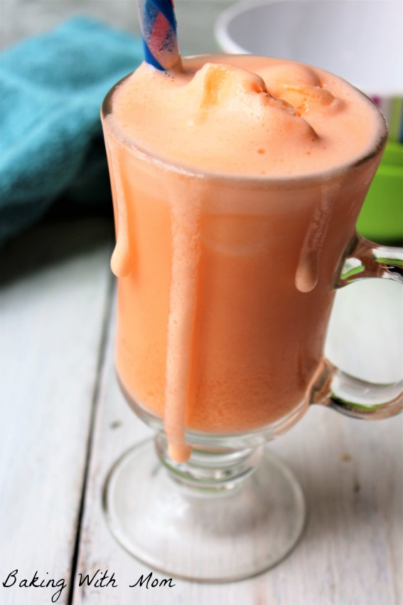 3 Ingredient Orange Vanilla Frosty in a clear cup with a blue straw