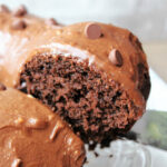 Mocha cake slice with a spatula.