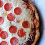 pepperoni pizza with a crust.