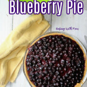 no bake blueberry pie with a green bowl behind.