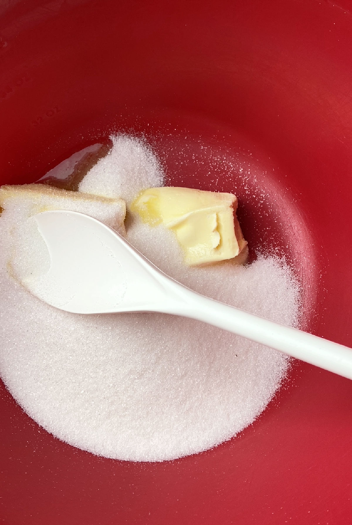 sugar and butter in a red bowl