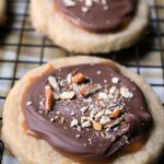 Caramel Shortbread Cookies topped with caramel, chocolate and pretzels