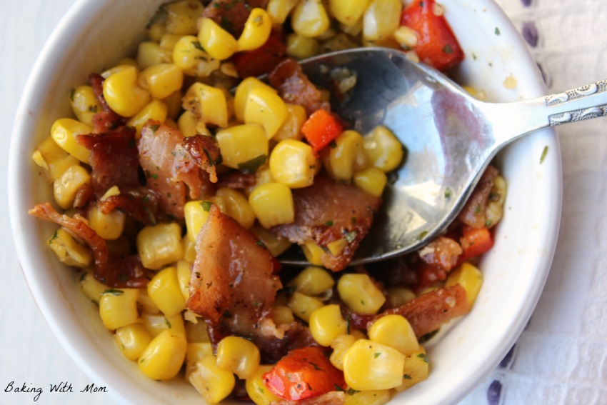 Sizzling Bacon Ranch Corn with a silver spoon in a white bowl