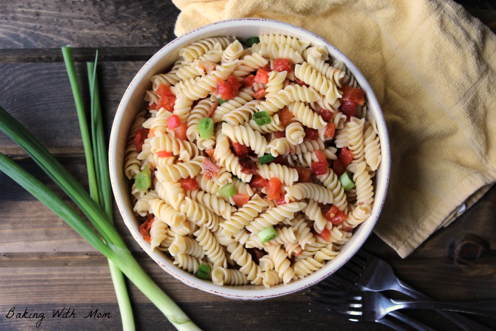 4 Ingredient Pasta Salad with tomatoes, pasta and green onions in a cream colored bowl