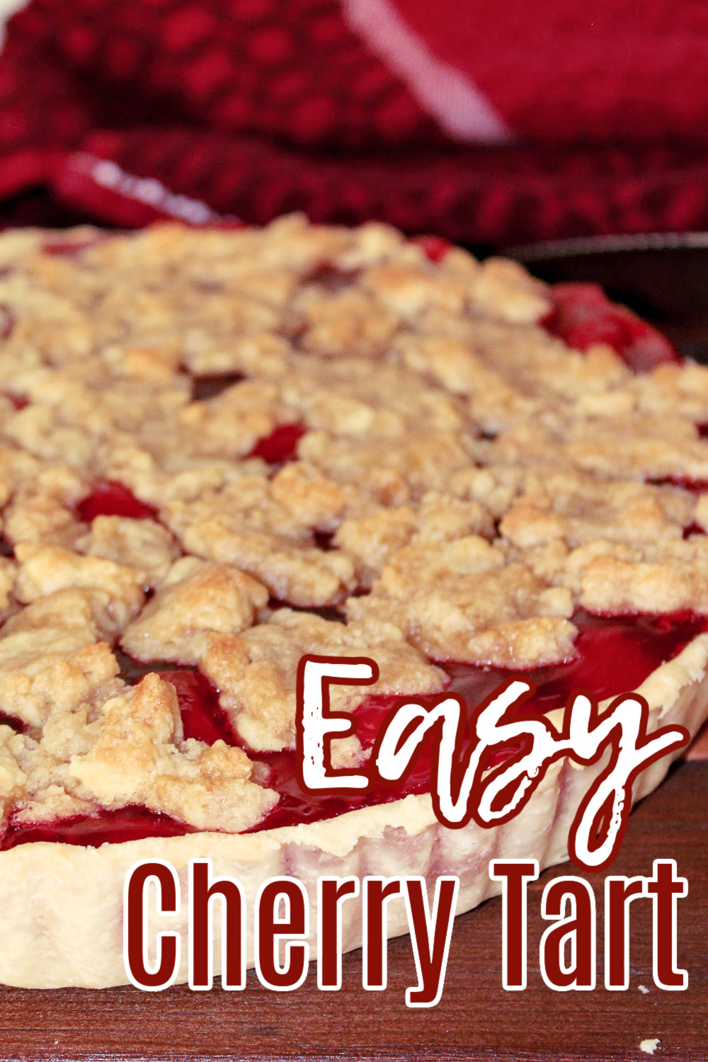 cherry tart with a towel behind. 